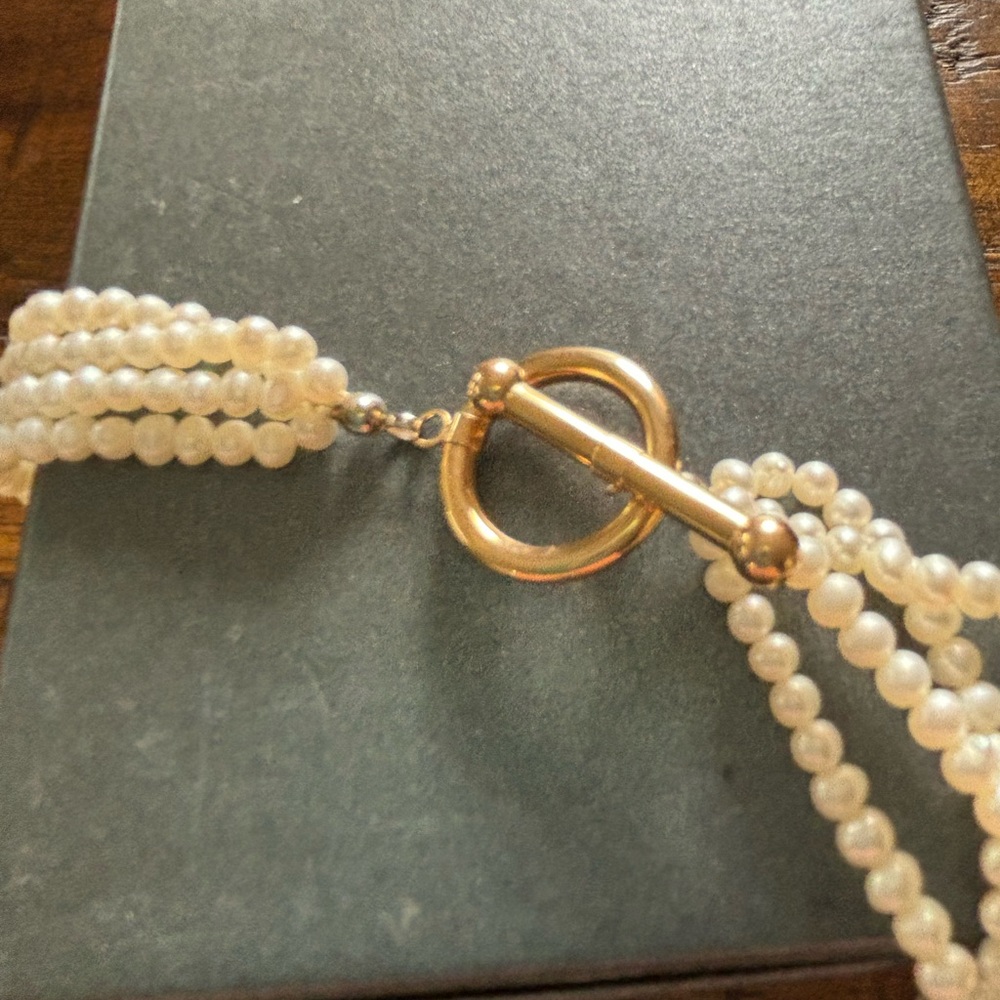 16 inch 4 strand seed pearl necklace with 14 KT gold toggle style clasp